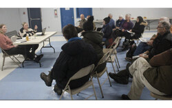 Deschênes district councillor Caroline Murray converses with a two-row assembly of concerned residents. Photo: JD Potié