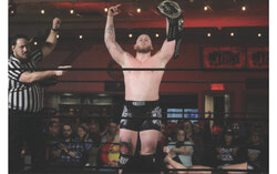 Some 200 wrestling fans gathered at the Aydelu Centre as professional wrestlers from as far as England participated in Mystery Wrestling 14, March 2. Pictured, Nottingham, England native and New Japan Pro Wrestling Openweight Champion Gabe Kidd raises his arms in victory after winning the main event. Photo: J-D Potie