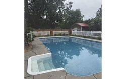 An inground pool in Aylmer, already enclosed by a six-foot fence and additional safety measures, still falls short of Quebec’s updated regulations—highlighting how even well-secured pools must meet new provincial standards by September 30. Photo: Courtesy