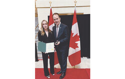 Marie-Soleil Labelle accompanied by Steven MacKinnon, Member of Parliament for Gatineau, holding the Coronation Medal of King Charles III. (June 14, 2025). Photo: Courtesy