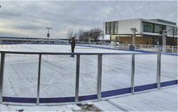 The refrigerated rink being set up in the parking lot of the Robert-Middlemiss Pavilion. Workers can be seen pouring water on the rink, set to open this week on November 14. Photo: Sophie Demers 