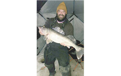 Anthony Bryan Rivera, one of the Ice Fishing Derby organizers and the force behind 819 Fishing Tactics, pictured with his fresh-caught Walleye, January 10. Photo : 819 Fishing Tactics