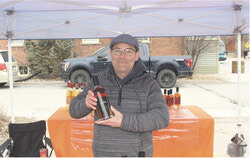 Martin Beaulac of Domaine Kildare selling products at his booth.