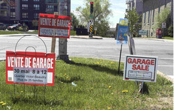 All the garage sales signs at the intersection of Principale Street and Boulevard Wilfrid-Lavigne on Friday, May 22 2026. Photo: Jude Osmond