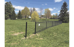 Photos: Newly installed poles that separate sections of the new community garden at the Bourgeau park. Photo: Jude Osmond