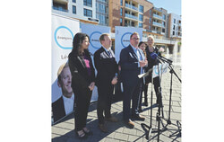 Coalition Avenir Québec candidates Mariana Mefleh, Mathieu Lévesque, William Robertson, Suzanne Tremblay and Linda Gauthier, from left, present the party's plan for a regional approach to vehicle registration and tax residency at the Agora in Aylmer's Plateau district on September 25. Photo: Tashi Farmilo
