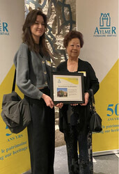 Mrs So Seto, proprietor of the local Bambou Restaurant, shown with her granddaughter Cassandra, received a citation for her red-brick, square box commercial building, built in 1923, at the Aylmer Heritage Association's 