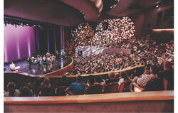 OrKidstra student Shania Braunovan recites her poem during the NAC Orchestra’s performance of Vivaldi’s The Four Seasons at the Canadian Museum of History, part of the SPHERE Festival on September 15. OrKidstra students contributed both music and bilingual poetry, reflecting the program’s mission to empower young musicians through community engagement. Photo: Greggory Clark